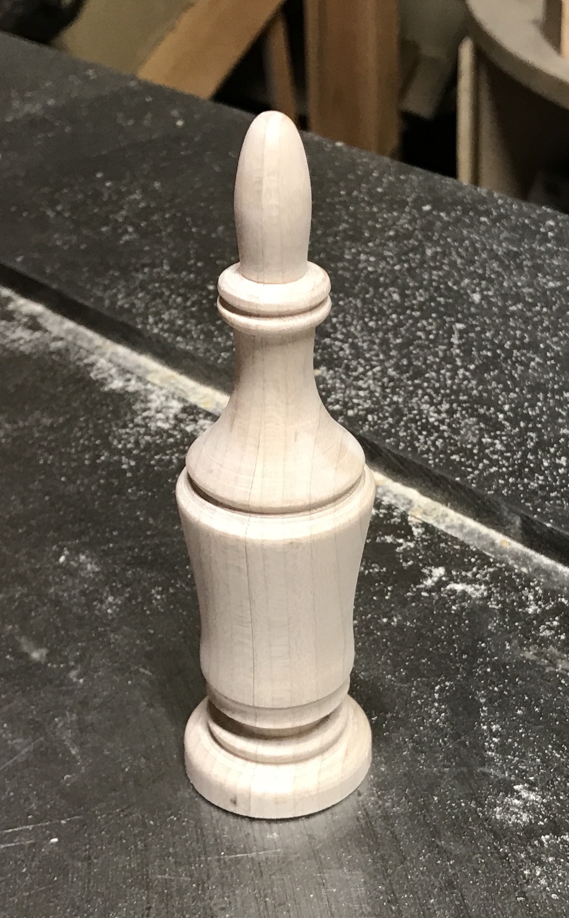 The finial cut free of the stock